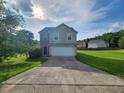 Charming two-story home featuring a two-car garage, stone accents, and a well-manicured lawn at 378 Durmire Dr, Jonesboro, GA 30236