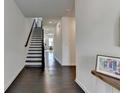 Spacious foyer with hardwood floors and a staircase leading to the upper level of the home at 4583 Roskin St, Duluth, GA 30097