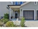 Close-up view of the front entrance with a black front door and manicured landscaping, offering great curb appeal at 4583 Roskin St, Duluth, GA 30097