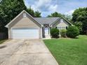 Charming single-Gathering home with a well-maintained front yard and a two-car garage at 535 Village Cir, Stockbridge, GA 30281