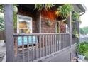 Inviting front porch with wood railings, hanging plants, and comfortable bench seating at 770 Barnett Street Ne, Atlanta, GA 30306