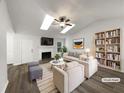 Bright living room with vaulted ceilings, fireplace, and stylish furnishings at 7972 Woodlake Dr, Riverdale, GA 30274