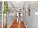 Inviting foyer with hardwood floors, neutral paint, and views into the living area at 918 Harvest Brook Dr, Lawrenceville, GA 30043