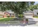 Charming one-story home featuring a well-manicured lawn and an attached two-car garage at 1875 Conners Ct, Lawrenceville, GA 30044