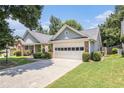 Inviting one-story home with attached garage and manicured lawn and shrubbery at 1875 Conners Ct, Lawrenceville, GA 30044