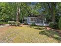 Beautifully maintained home featuring a covered front porch and well-manicured front yard at 2130 Main Nw St, Atlanta, GA 30318