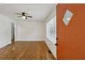 Bright living room features hardwood floors, a ceiling fan, and neutral paint at 2130 Main Nw St, Atlanta, GA 30318