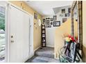Inviting entryway with tiled floor, white front door, and staircase decorated with Gathering photos at 179 Parkside Dr, Stockbridge, GA 30281