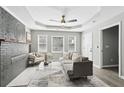 Light-filled living room with modern decor, featuring a tray ceiling and cozy seating at 524 Paines Nw Ave, Atlanta, GA 30318