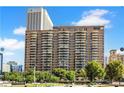 Modern high-rise apartment building featuring private balconies for each unit at 620 Peachtree #901 Ne St, Atlanta, GA 30308