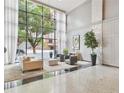 Elegant lobby area with large windows and stylish seating at 620 Peachtree #901 Ne St, Atlanta, GA 30308