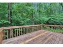 Spacious wooden deck overlooking private, wooded backyard at 7704 Holyoke Rd, Cumming, GA 30040