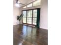 Bright living room with hardwood floors, large windows, and a view to the greenery outside at 6264 Godfrey Sw Dr, Mableton, GA 30126
