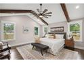 Bright and airy main bedroom with vaulted ceiling, wooden beams, and large windows at 942 Mclinden Se Ave, Smyrna, GA 30080