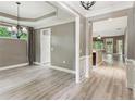 Spacious dining room with modern lighting, white trim and views into the backyard at 328 Shade Tree Cir, Woodstock, GA 30188