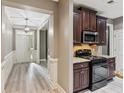 Open foyer leads to the dining room, kitchen and living room, complete with hard surface floors at 328 Shade Tree Cir, Woodstock, GA 30188