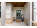 Charming front porch with decorative accents, a welcoming entrance and a friendly atmosphere at 4814 Little Cove Ct, Auburn, GA 30011