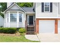 Close up of the front exterior highlighting the entryway and the two-car garage at 1093 Athena Ct, Acworth, GA 30101