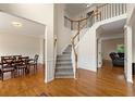Spacious foyer with hardwood floors, staircase and adjacent dining and living spaces at 1413 Eastbrooke Way, Marietta, GA 30066