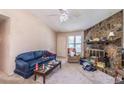 Inviting living room with natural light, a stone fireplace, and comfortable seating, perfect for Gathering gatherings at 504 Azalea Ct, Woodstock, GA 30188