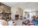 Cozy living room featuring a stone fireplace and ample space for relaxation and entertainment at 504 Azalea Ct, Woodstock, GA 30188