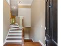Home foyer featuring wooden floors, stairs, and neutral wall paint at 2969 Rivergreen Se Ln # 23, Atlanta, GA 30339