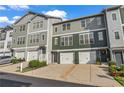Charming townhome exterior featuring a private garage, well-maintained landscaping, and inviting curb appeal at 3014 Liberty Nw Way, Atlanta, GA 30318