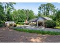 Spacious carport with ample parking and storage space, blending functionality with classic architectural design at 435 Old Holly Rd, Milton, GA 30075