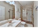 Modern bathroom featuring a tiled shower with glass door and a vanity at 711 Topsail Ln, Alpharetta, GA 30005