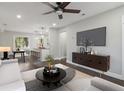 Bright living room boasts hardwood floors, modern furniture, and recessed lighting for a cozy ambiance at 2349 Springdale Rd, Atlanta, GA 30315