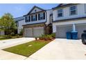 Well-maintained townhouse with an attached garage and a neatly kept lawn at 4098 Haleston Rd, Duluth, GA 30097