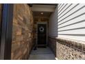 Inviting front entrance features a brick wall and decorative floral wreath at 4098 Haleston Rd, Duluth, GA 30097
