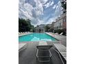 Beautiful community pool with lounge chairs, offering a relaxing and refreshing outdoor space at 6459 Chariot St # 35, Atlanta, GA 30328