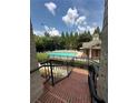 Inviting community pool with lounge chairs and a charming pool house surrounded by lush greenery at 6459 Chariot St # 35, Atlanta, GA 30328