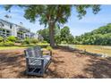 Scenic community view with a bench overlooking the river and lush greenery at 1023 Riverbend Club Se Dr, Atlanta, GA 30339