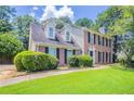 Traditional brick home with dormers and mature landscaping at 1797 Emerson Lake Cir, Snellville, GA 30078