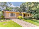 Inviting single-story home featuring a well-maintained lawn and a cozy front porch at 2783 Bicentennial Dr, Stone Mountain, GA 30087