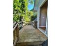 Exterior deck leads to the entrance with wooden railing at 782 Myrtle Ne St # B, Atlanta, GA 30308