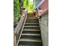 Exterior staircase with wooden rails leading to the entrance of the building at 782 Myrtle Ne St # B, Atlanta, GA 30308