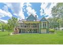 Expansive green backyard featuring a large wooden deck, perfect for outdoor entertaining and relaxation at 2010 Bennett Rd, Grayson, GA 30017