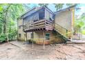 The backyard features a porch, brick exterior, and fenced-in yard at 2116 Twin Falls Rd, Decatur, GA 30032