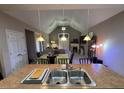 Open concept kitchen with an island and a view of the dining and living areas at 1604 Haven Cir, Douglasville, GA 30135