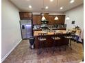 A kitchen featuring stainless steel appliances, an island with seating, and ample counter space at 1604 Haven Cir, Douglasville, GA 30135