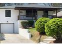Attractive bungalow with a covered front porch, driveway, and tidy landscaping at 662 Gary Nw Rd, Atlanta, GA 30318