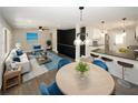 Spacious open-concept living area with stylish furniture, hardwood floors, and abundant natural light at 662 Gary Nw Rd, Atlanta, GA 30318