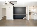 Open concept living area with hardwood floors, modern finishes, and a view into the kitchen at 662 Gary Nw Rd, Atlanta, GA 30318