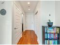 Inviting hallway featuring hardwood floors and modern finishes, leading to various rooms at 1080 Peachtree Ne St # 1208, Atlanta, GA 30309