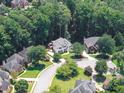 A beautiful aerial view of a home nestled in a lush, green neighborhood at 1630 Reindeer Rdg, Alpharetta, GA 30005
