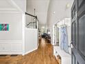 Inviting foyer with hardwood floors and a view into the living room at 1630 Reindeer Rdg, Alpharetta, GA 30005