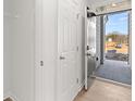 Open entryway with a dark gray door, storage closet, and a glimpse of the front yard at 4449 Manor Hill Dr, Union City, GA 30291